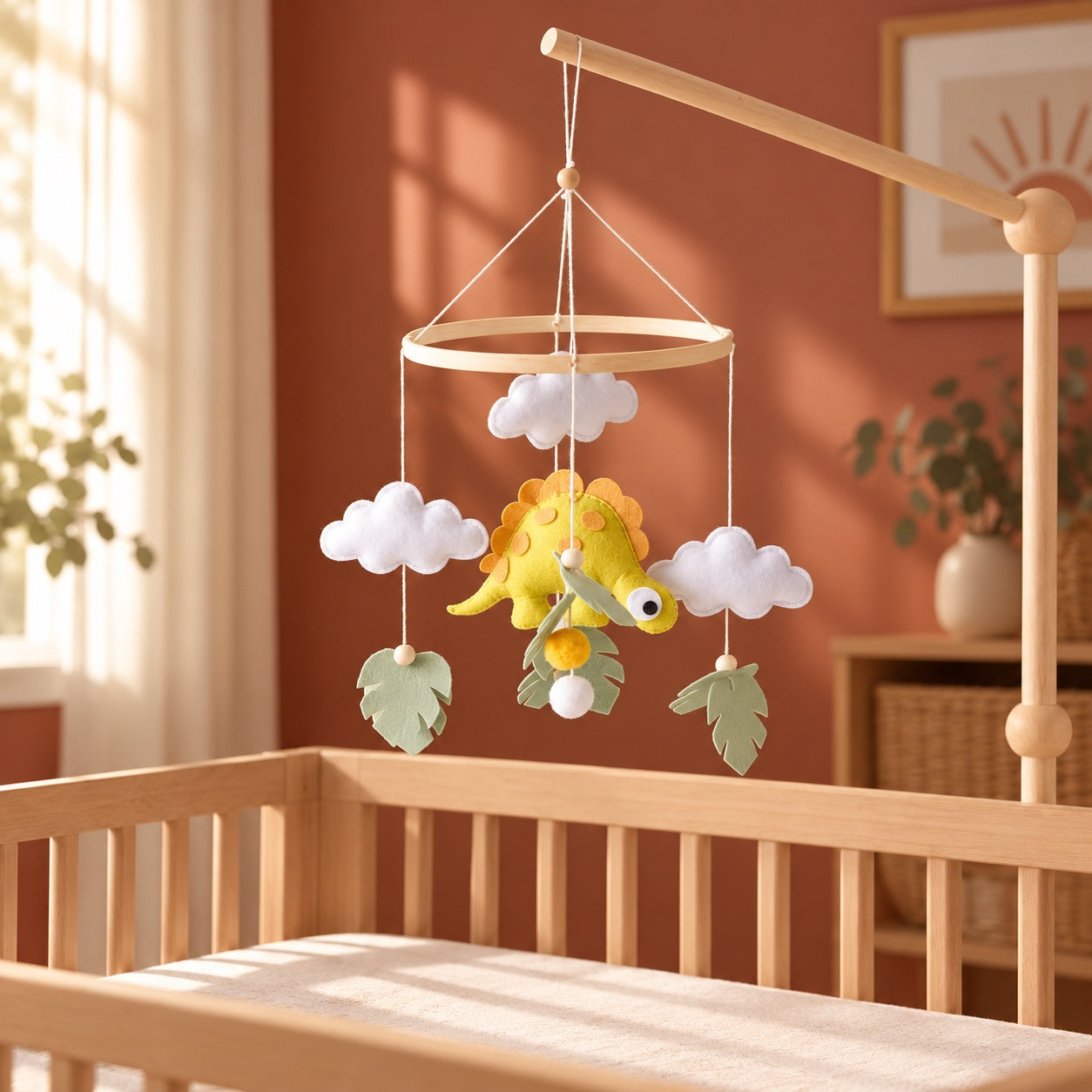 Dinosaur baby mobile styled in a bright nursery