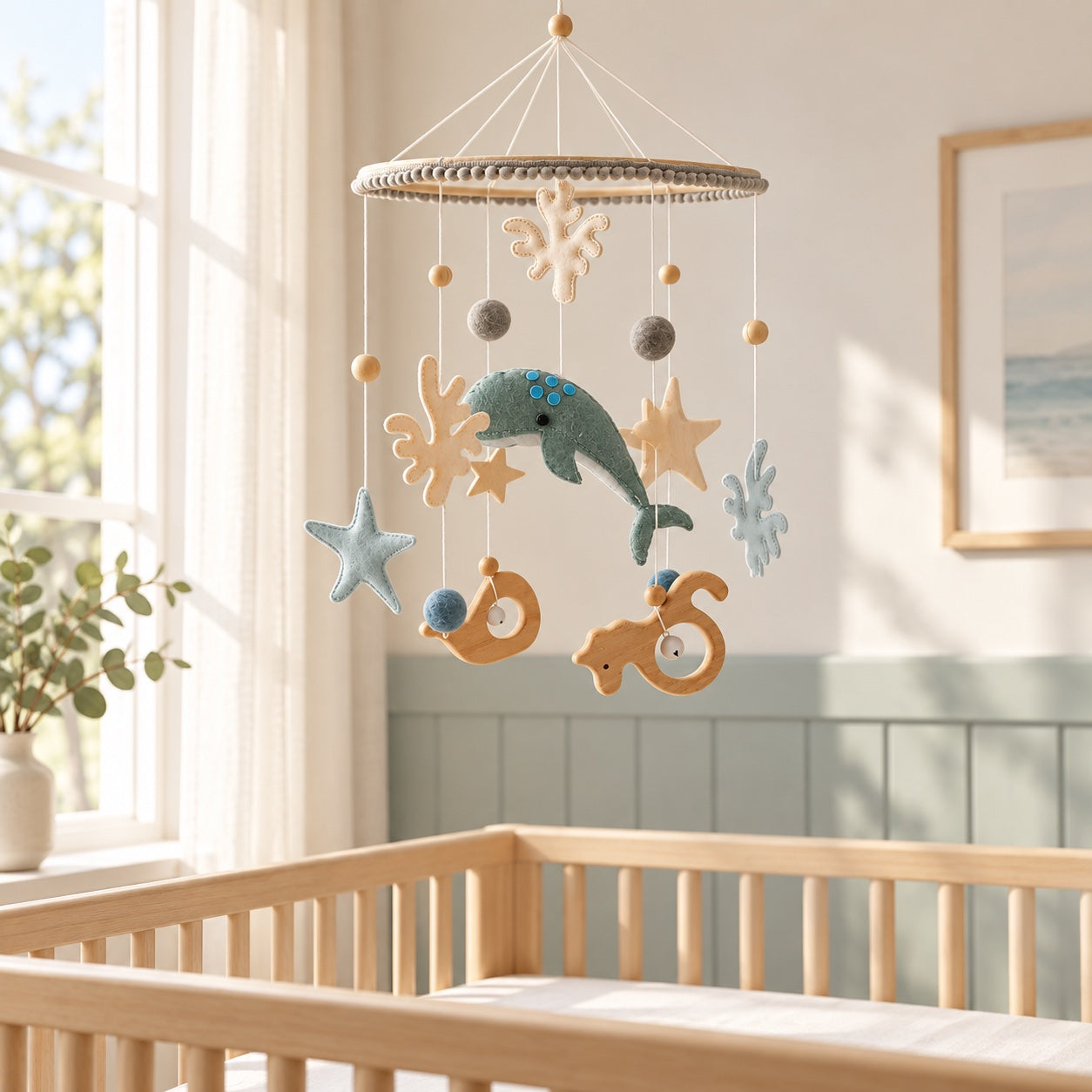 Whale baby mobile styled in a bright nursery