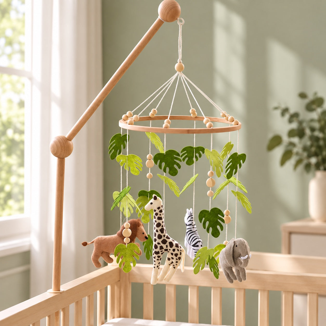 Safari baby mobile styled in a bright nursery