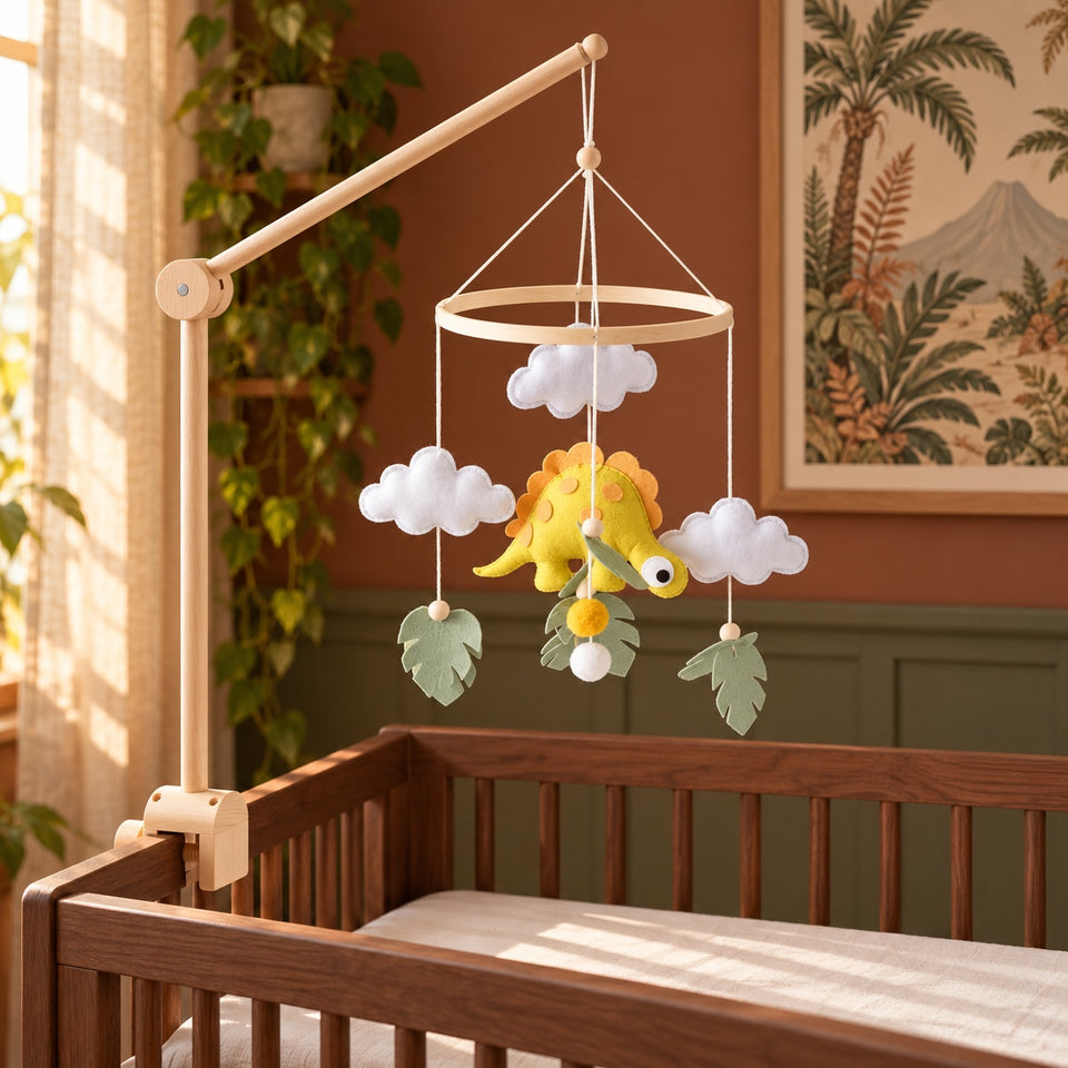 Dinosaur baby mobile in a styled nursery
